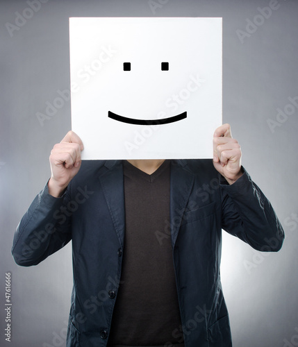 Man behind smiley symbol