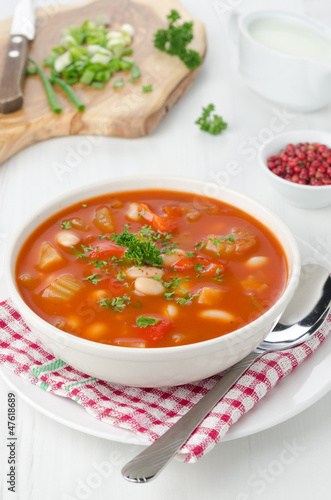 bowl of roasted tomato soup with beans, celery and sweet pepper