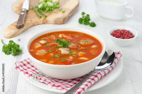 bowl of roasted tomato soup with beans, celery and sweet pepper