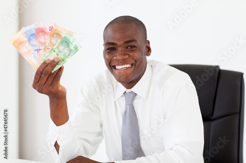 african businessman with south african cash notes