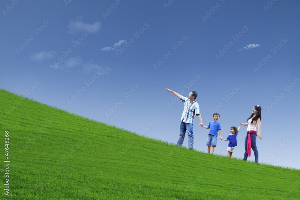 Happy family trip on hill