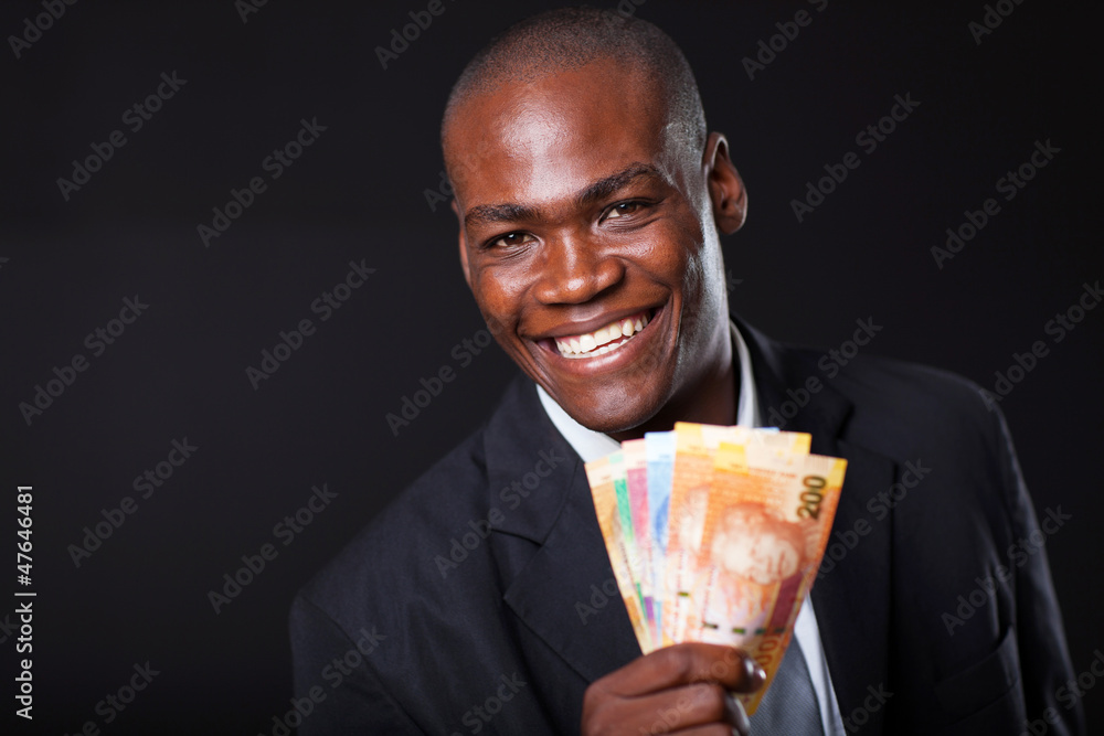 happy african businessman with south african cash notes happy african businessman with south african cash notes