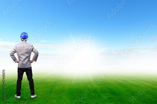 Engineers person standing on green grass field