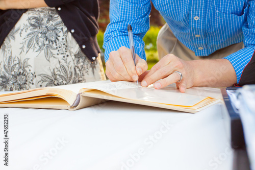 Photos Signing a Guestbook