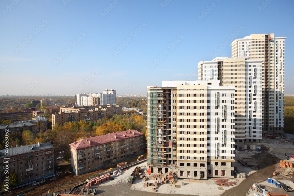Naklejka premium Three buildings under construction