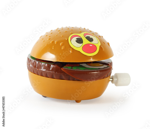 Plastic toy mechanical hamburger isolated on white background. photo