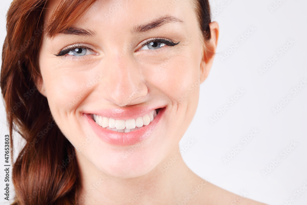 Close-up of beautiful smiling young and pretty caucasian woman. Close-up of beautiful smiling young and pretty caucasian woman.