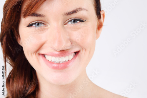 Close-up of beautiful smiling young and pretty caucasian woman.