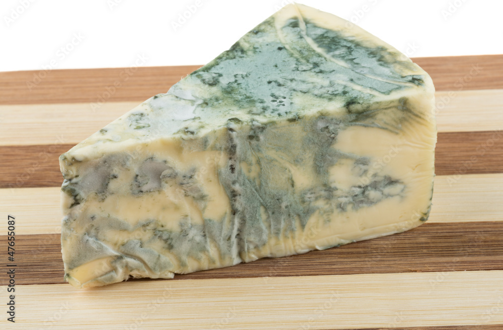 Wedge of soft blue cheese, isolated on white Wedge of soft blue cheese, isolated on white