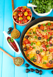 colorful composition of delicious pizza, vegetables and spices
