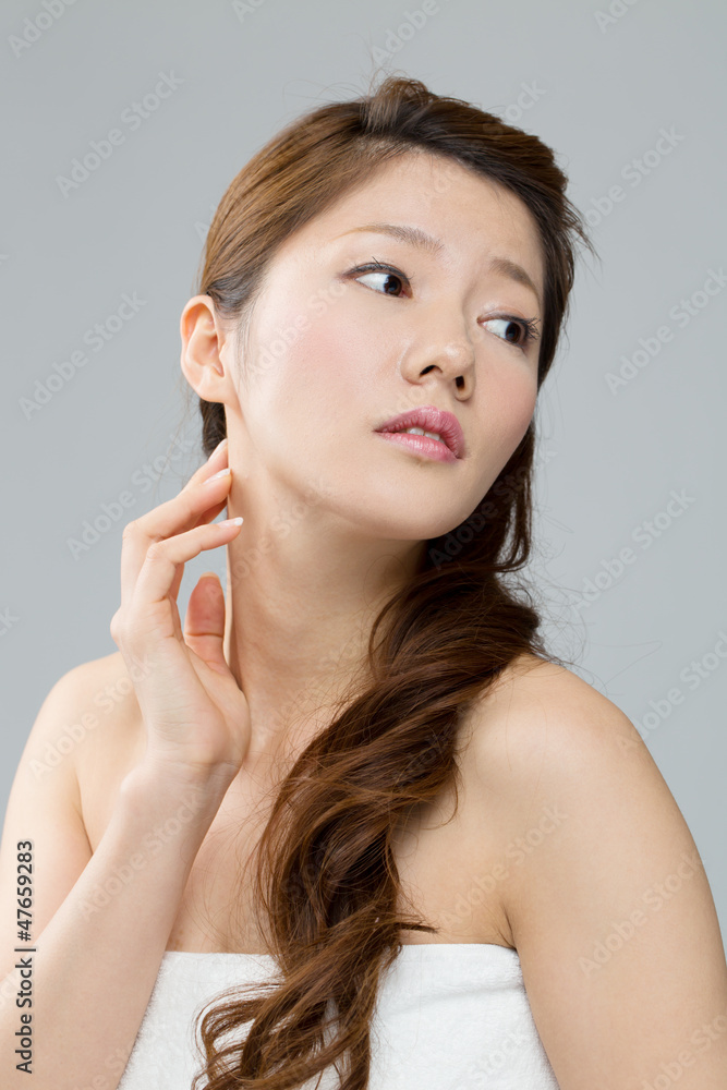 Beautiful asian woman on gray background Beautiful asian woman on gray background