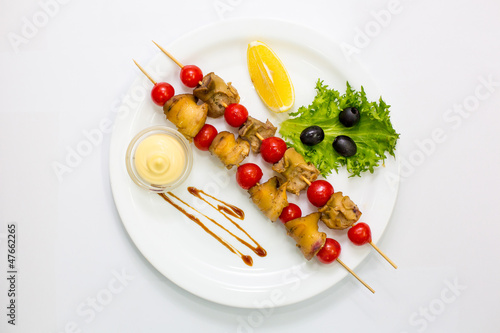 Rapana grill with vegetables and sauce