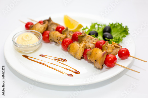 Rapana grill with vegetables and sauce
