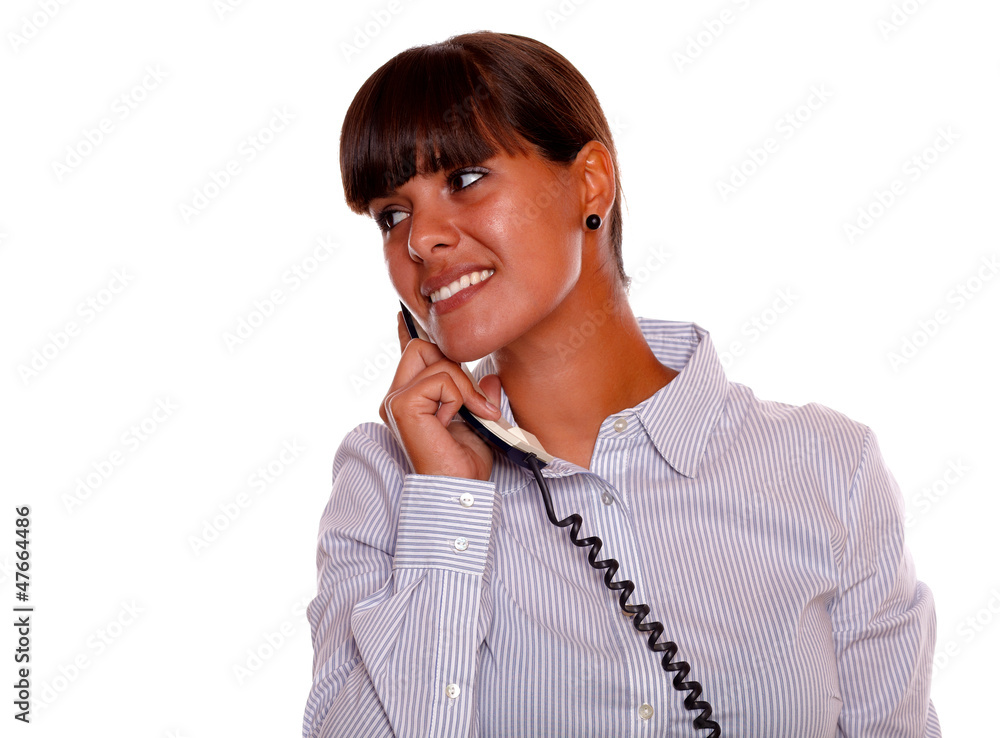 Smiling young woman looking right with phone Smiling young woman looking right with phone