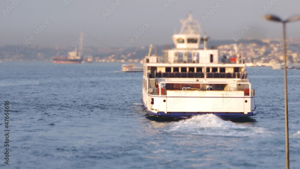 Ferryboat departs from port through the Bosphorus Ferryboat departs from port through the Bosphorus