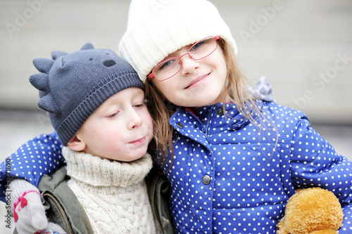 Outdoor portrait of child boy and little girl