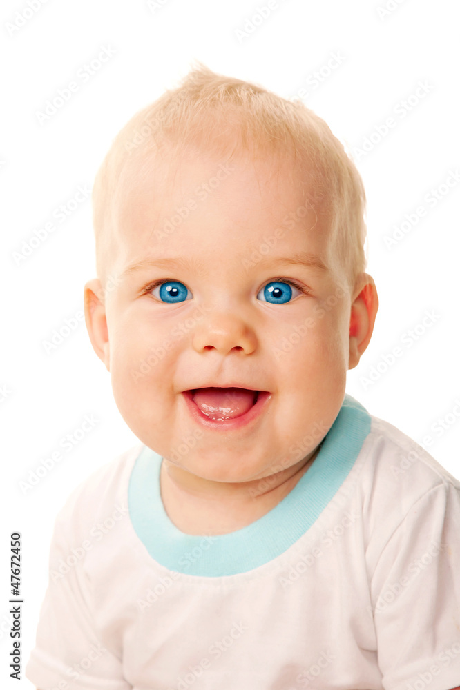 Smiling blue-eyed baby face close-up.