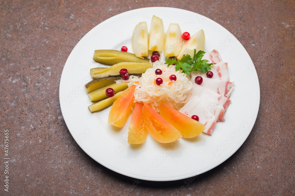 Plate with snacks on the table in a restaurant