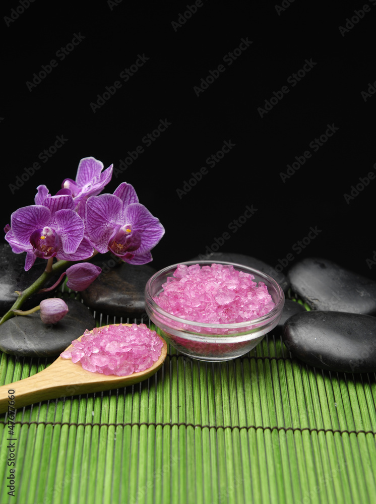 salt in wooden spoon and orchid and stone salt in wooden spoon and orchid and stone