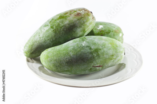 green mango on dish