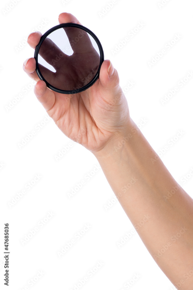 Fototapeta premium Hand holding polarization filter
