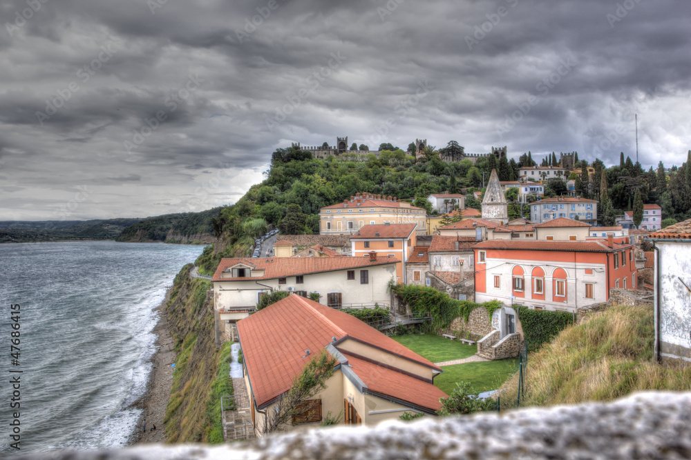Obraz premium View on the historical city of Piran under a threatening sky, Sl