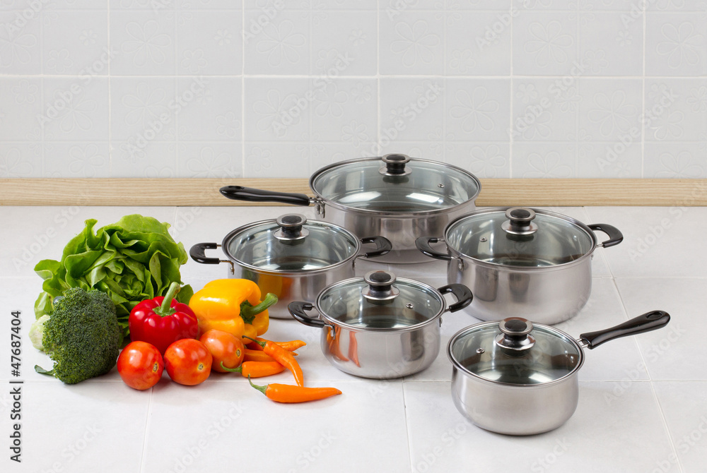 Set of stainless pots and pan with glass lids Set of stainless pots and pan with glass lids
