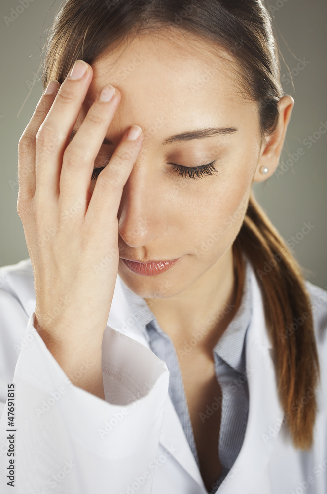 medical woman with headache at hospital