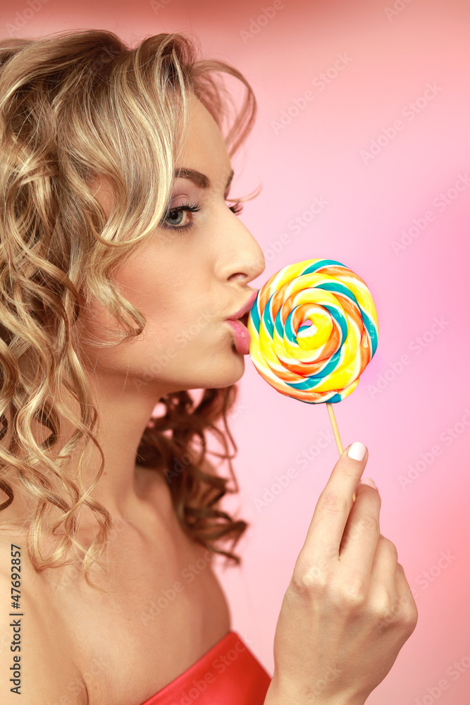 Young happy woman with lollipop