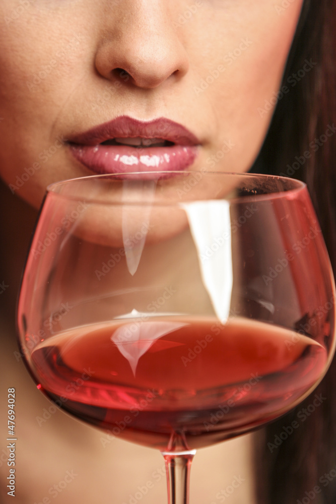 Womand drinking a tasteful glass of wine Womand drinking a tasteful glass of wine