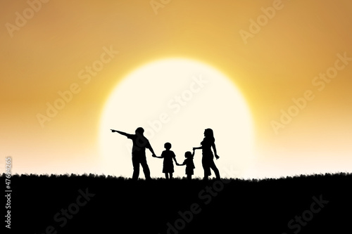Family silhouette on sunset © Creativa Images