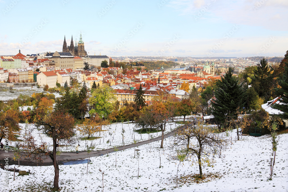 Snowy colorful autumn Prague with gothic Castle, Czech Republic