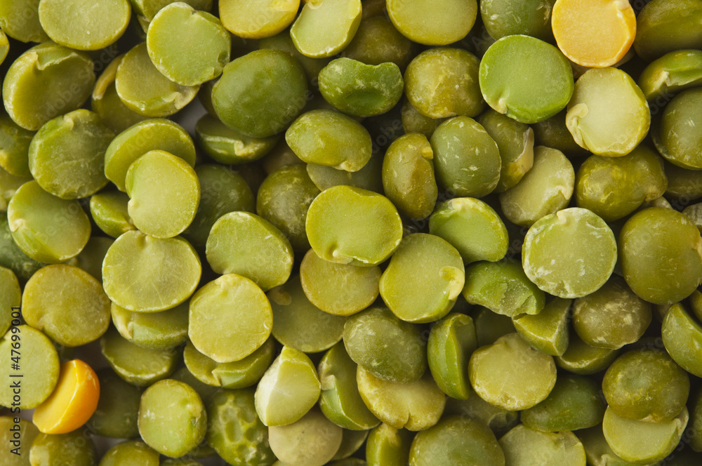 Dry split green peas texture background Dry split green peas texture background