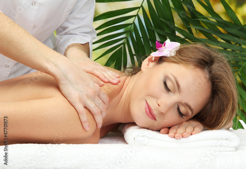 beautiful woman in spa salon  getting massage 