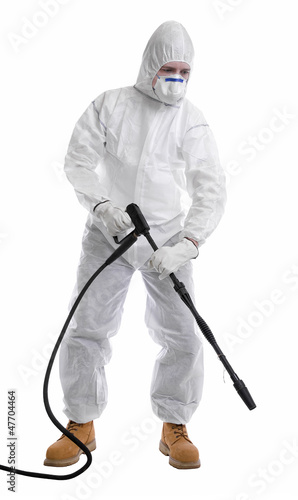 Cuadro en lienzo man in full protective clothing using pressure washer