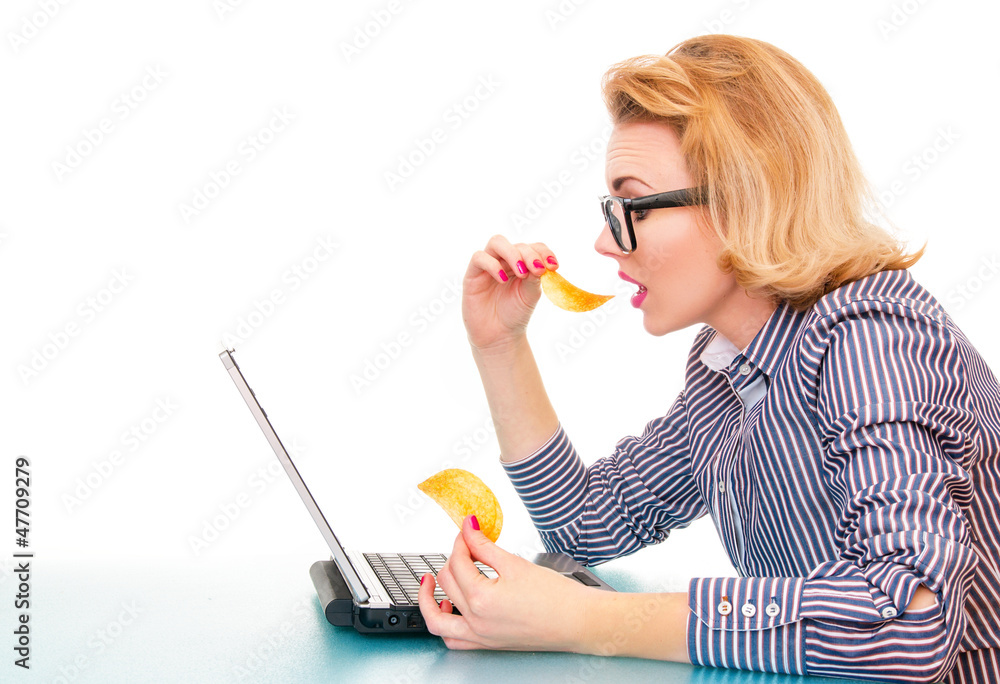 Profile of business woman eating chips on work Profile of business woman eating chips on work