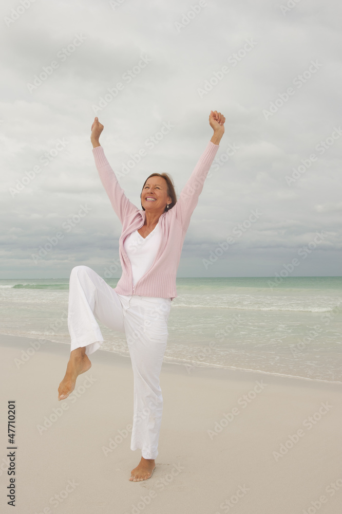 Joyful senior woman isolated ocean background Joyful senior woman isolated ocean background