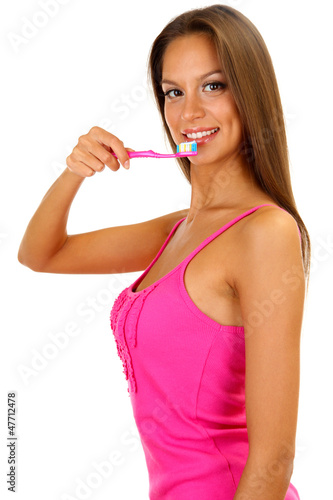 Beautiful young woman with toothbrush isolated on white