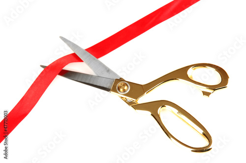 Cutting red ribbon isolated on white
