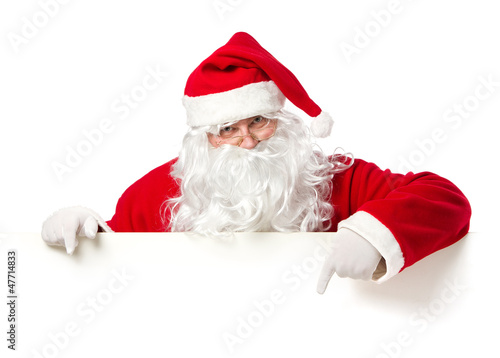 Santa Claus pointing in blank banner