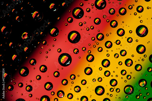 Reflection of Bolivia flag in water droplets