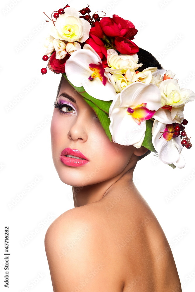 beautiful woman with bright makeup with colorful flowers on head