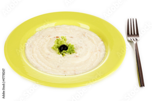 Mashed potatoes in green plate isolated on white