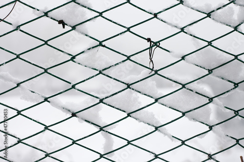 Fence covered by snow - background