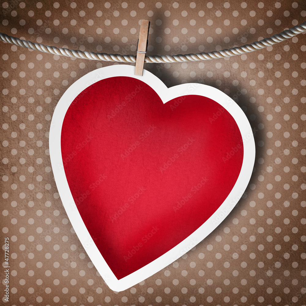 Valentine background: heart hanging on clothespin