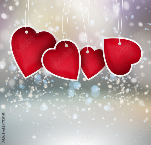 Valentine heart hanging labels on shining background