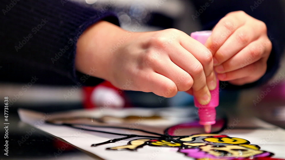 Little girl painting in concentration Little girl painting in concentration