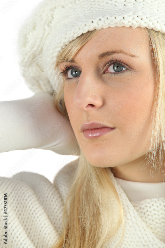 Woman wearing a sweater and a knitted hat Woman wearing a sweater and a knitted hat