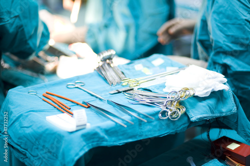 surgical instruments on a table in a real operating room photo