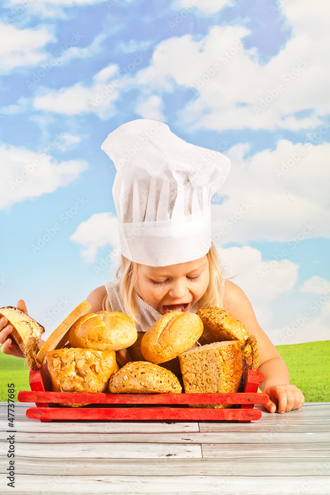 laughing pretty little girl in a checap with a basket bread laughing pretty little girl in a checap with a basket bread